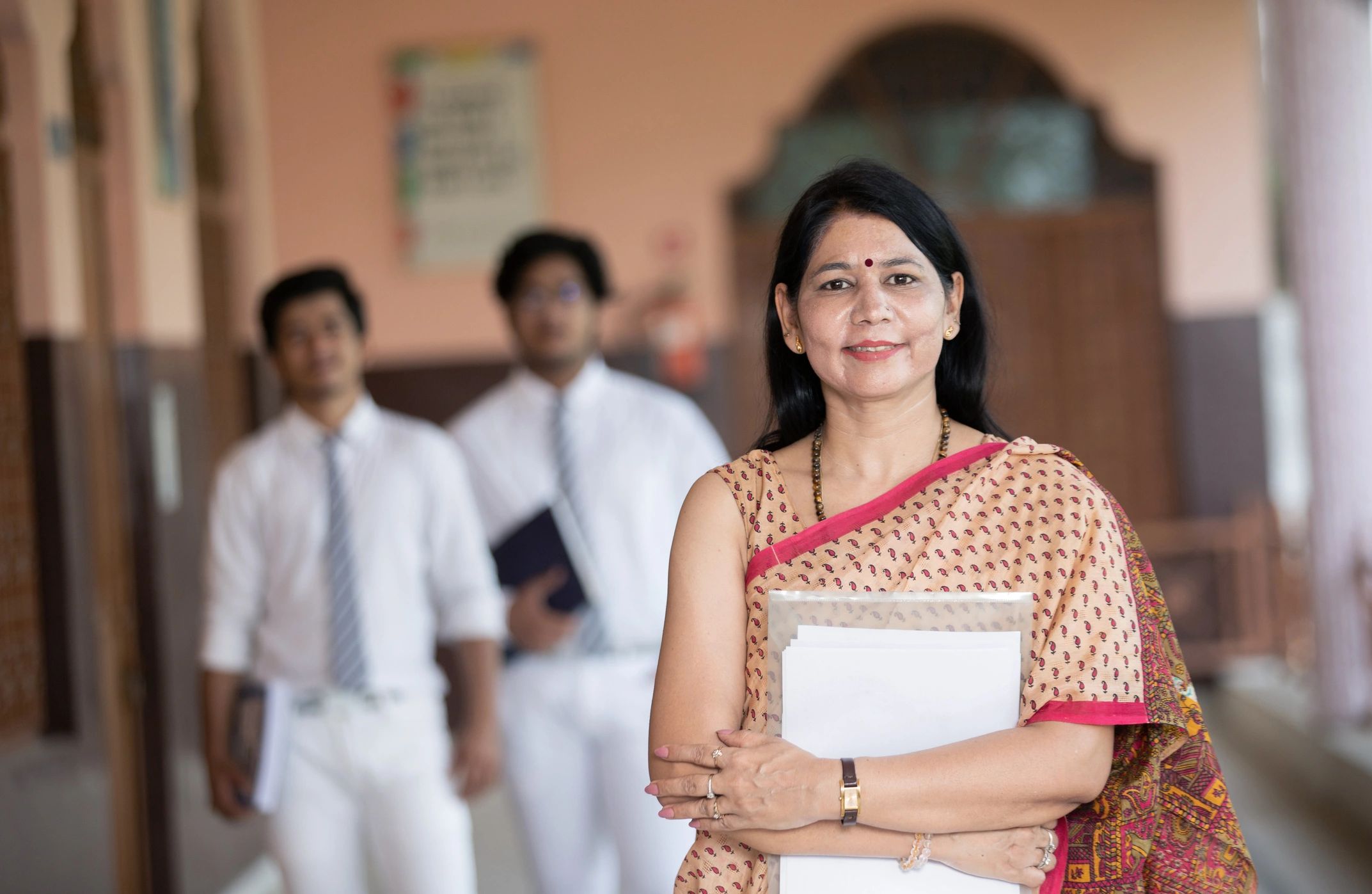 Indian educator with students representing culture and society