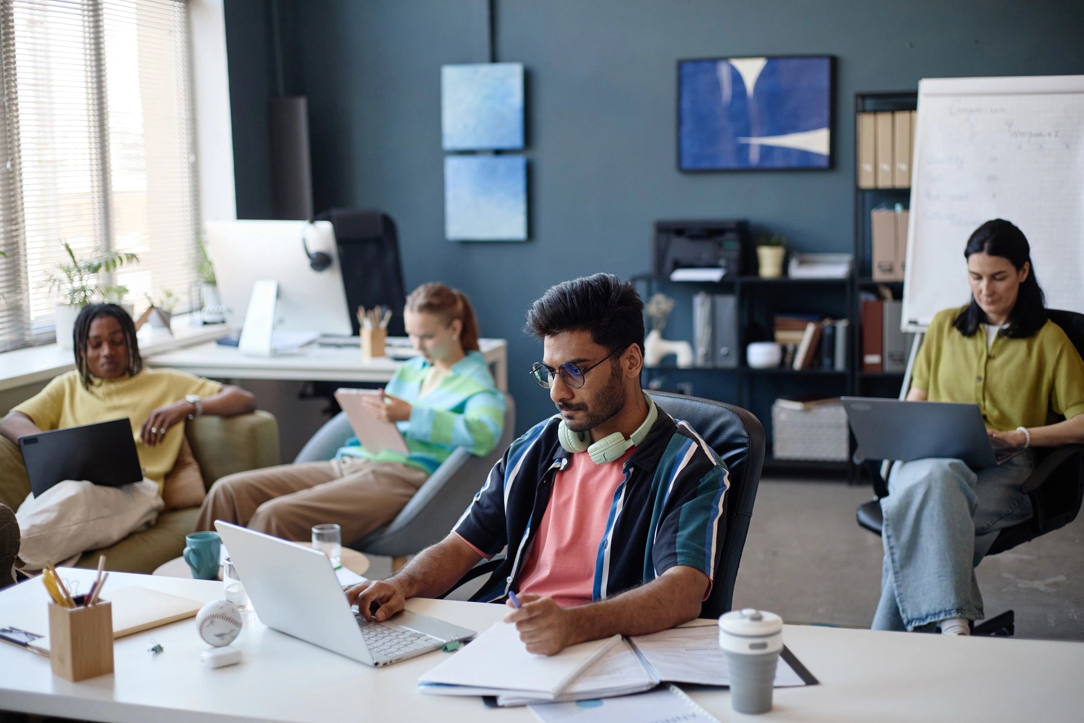 Editorial team collaborating in a newsroom setting