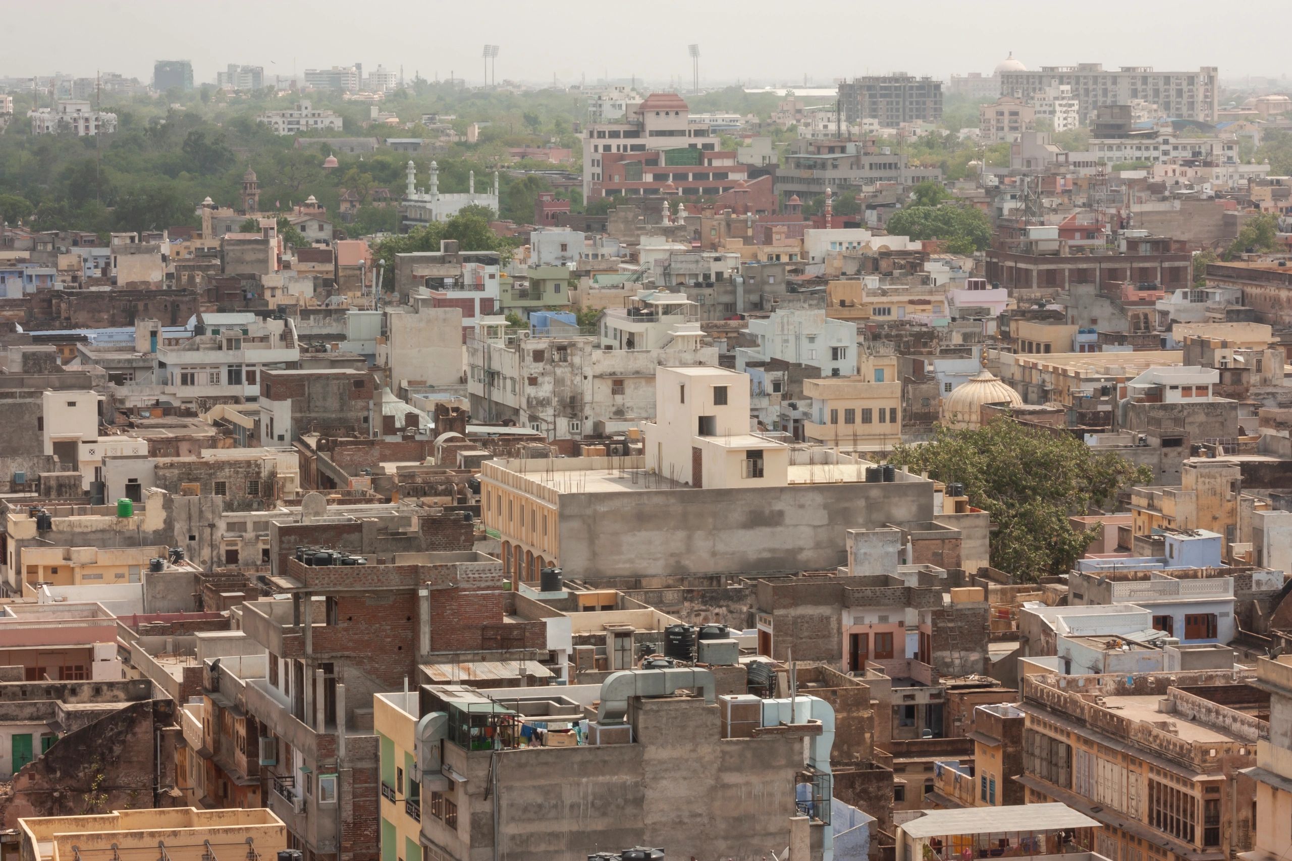 Dense Indian city rooftops representing urban growth and economy